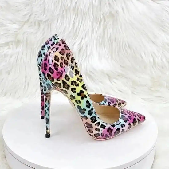 FashionFitz Vivid Leopard Stilettos on display stand with soft fur backdrop, featuring multicolour leopard print and elegant silhouette.