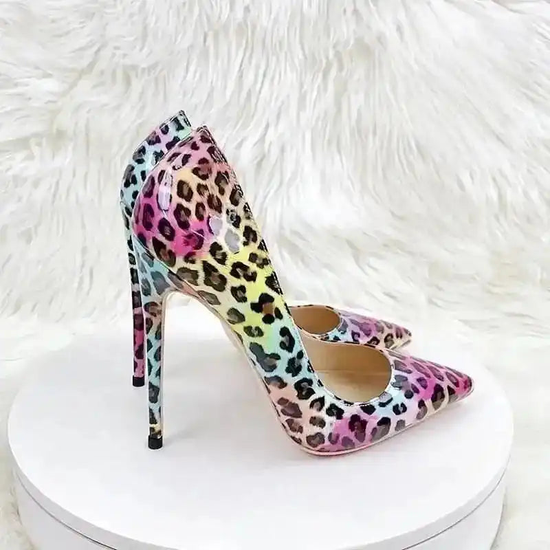 FashionFitz Vivid Leopard Stilettos on display stand with soft fur backdrop, featuring multicolour leopard print and elegant silhouette.