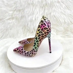 FashionFitz Vivid Leopard Stilettos displayed on white round platform with fur background, showcasing vibrant multicolour court heel design.