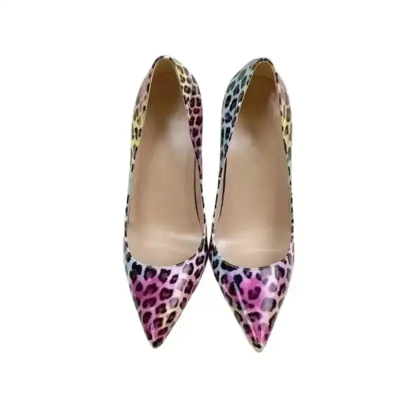 Top-down view of FashionFitz Vivid Leopard Stilettos showing symmetrical pointed toes and vibrant leopard pattern for stylish occasions.