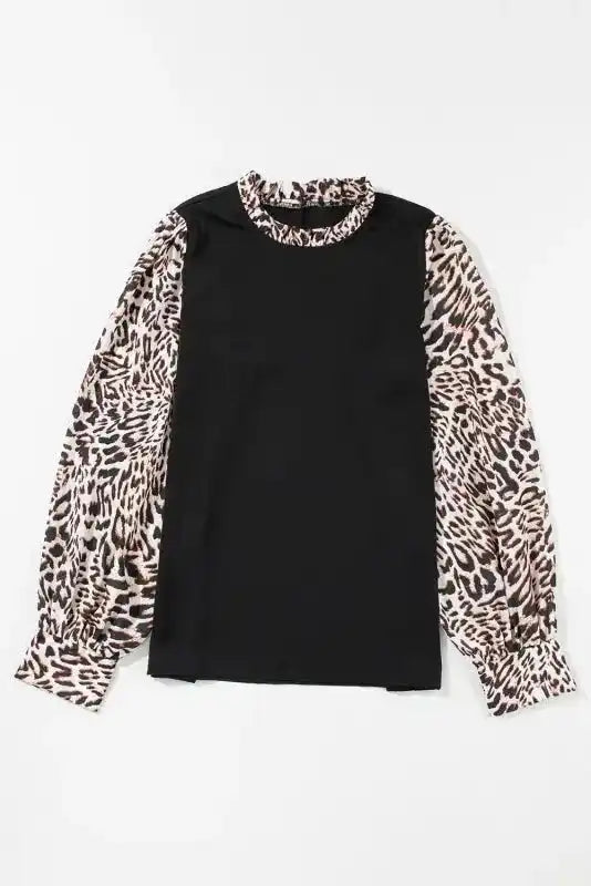 Flat lay of Contrast Leopard Sleeve Blouse - Chic Black, showcasing its structured silhouette and bold animal print sleeves.