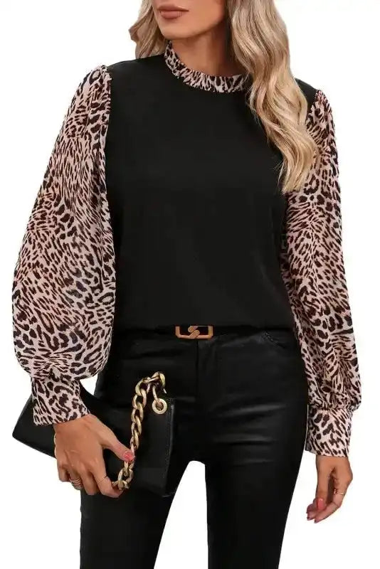 Front view of Contrast Leopard Sleeve Blouse - Chic Black on white background, highlighting its bold sleeve design and ruffled neckline.