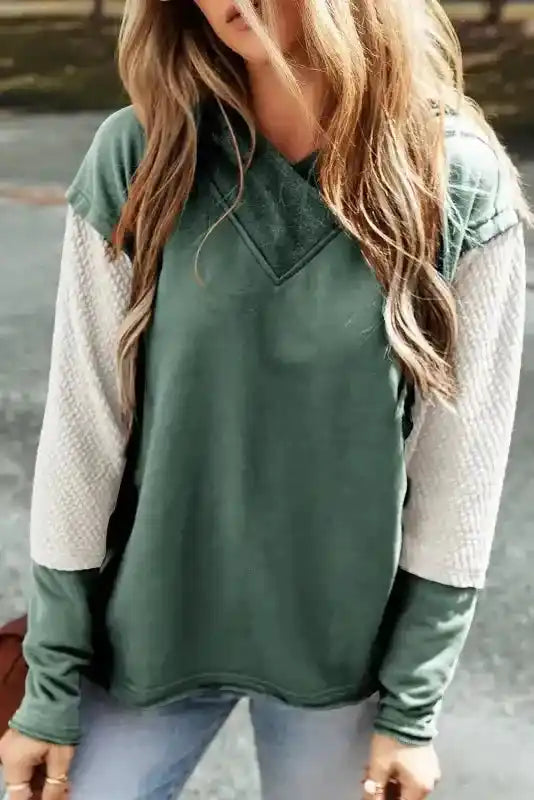 Green Contrast Patchwork Hoodie with light beige textured sleeves, cozy and stylish for casual fall looks.