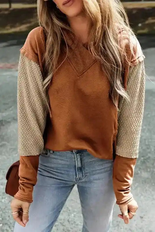 Brown hoodie with beige colorblock sleeves, part of the trendy Contrast Patchwork Hoodie collection.
