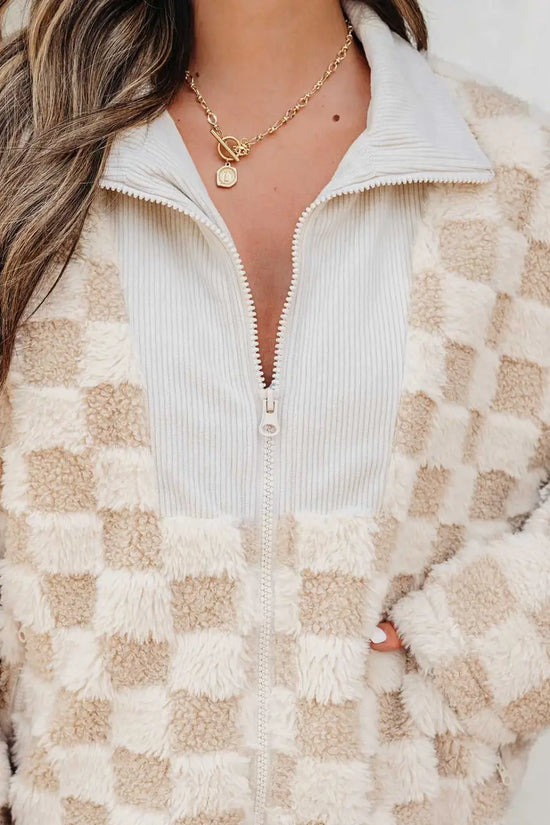 close-up of a Person wearing a Corduroy Sherpa Jacket with a neutral background