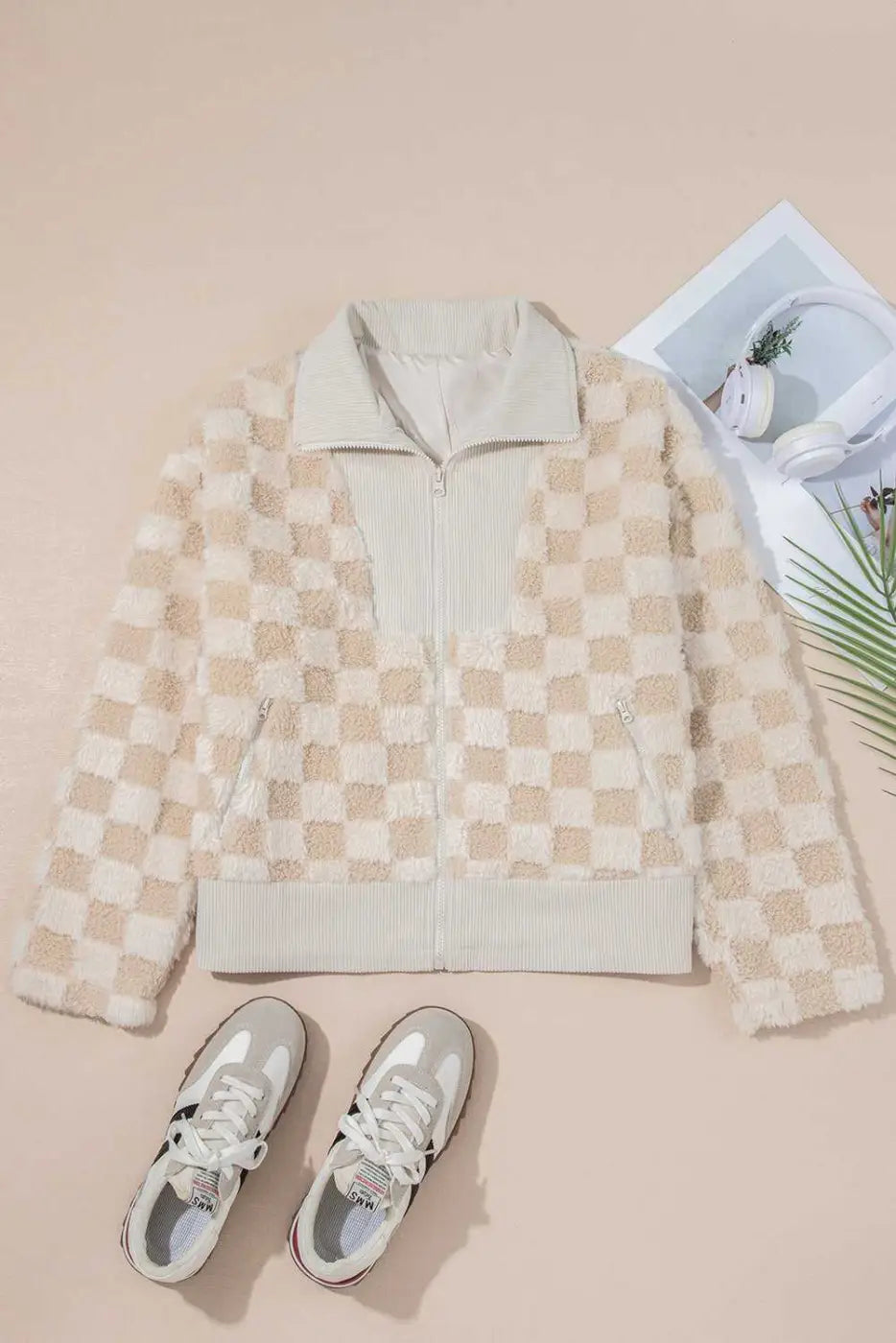 Checkered jacket with sneakers on a beige background