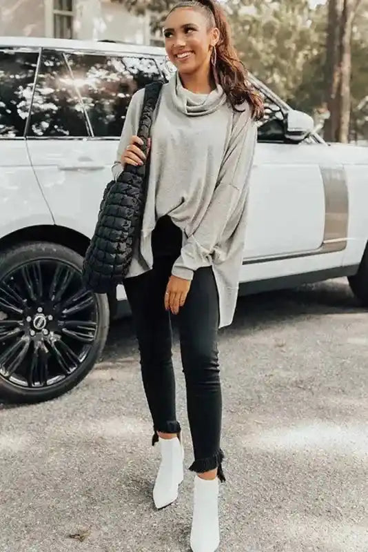 Gray Versatile Cowl Neck Shift Tunic Top styled with black fringe-hem jeans and white boots, ideal for a cozy winter day out.