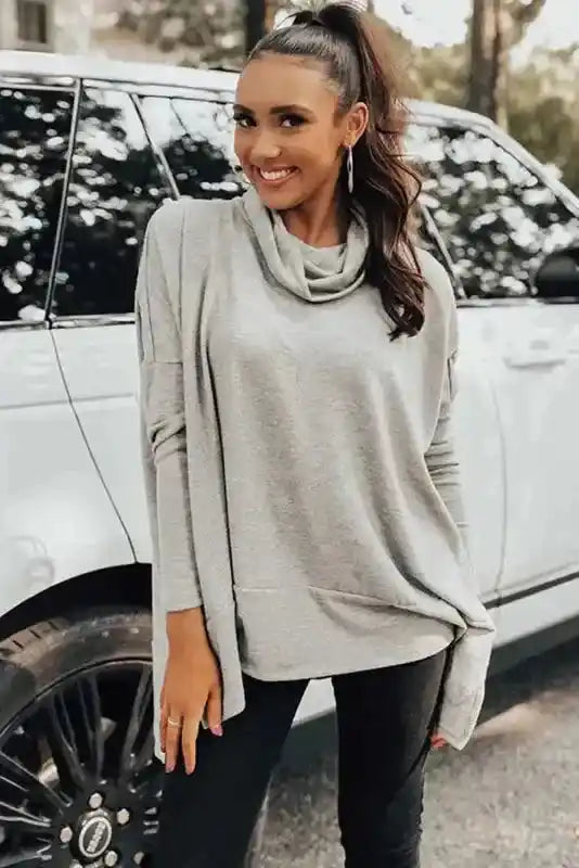 Gray Versatile Cowl Neck Shift Tunic Top styled with black jeans, showcasing a chic and comfortable winter wardrobe staple.