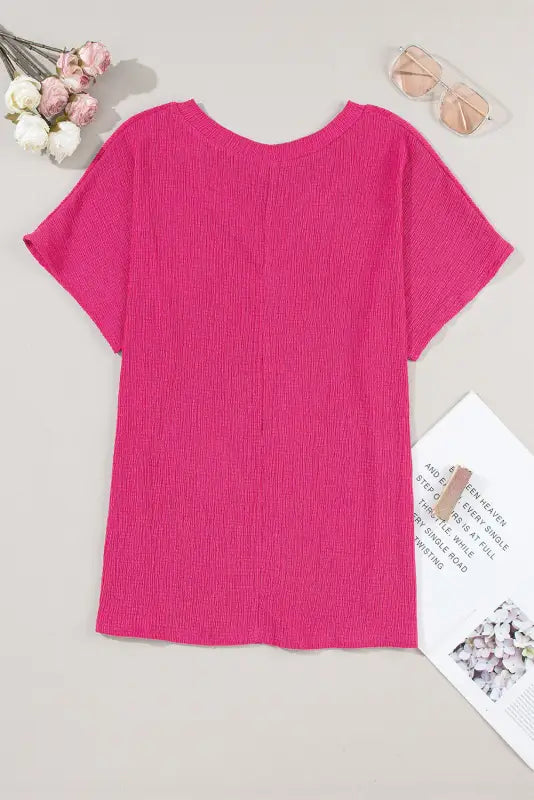 Bright pink textured short-sleeved t-shirt with crinkled v neck for a relaxed look