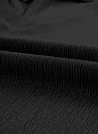 Close-up of black crinkled fabric texture, emphasizing the lightweight and airy material of the V-neck T-shirt.