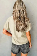 Back view of cream Crinkled V-Neck T-Shirt with wide sleeves, styled for a relaxed and casual summer outfit.