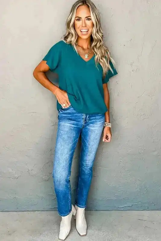 Full outfit with teal Crinkled V-Neck T-Shirt and jeans, styled for a casual and stylish summer day look.