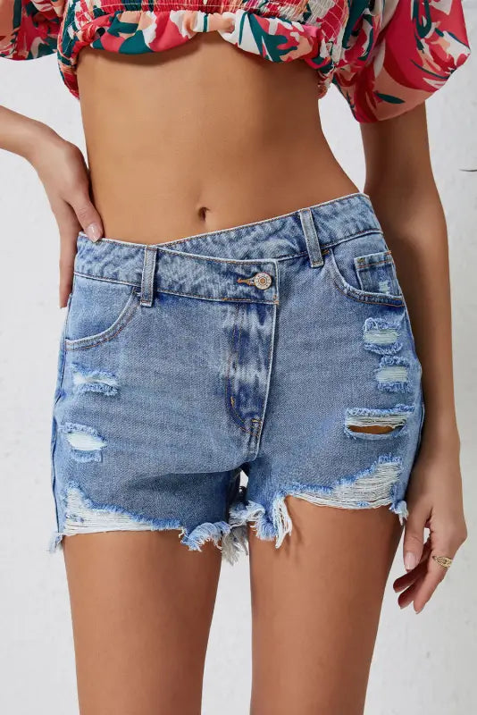 Crossover waist denim shorts: distressed with rips and frayed edges for a relax relax style