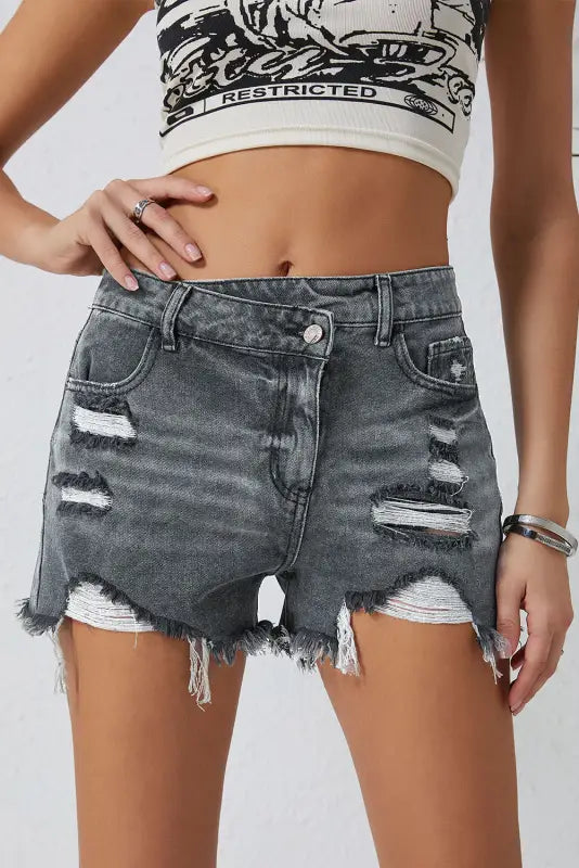 Crossover waist denim shorts: distressed gray denim with frayed edges and rips