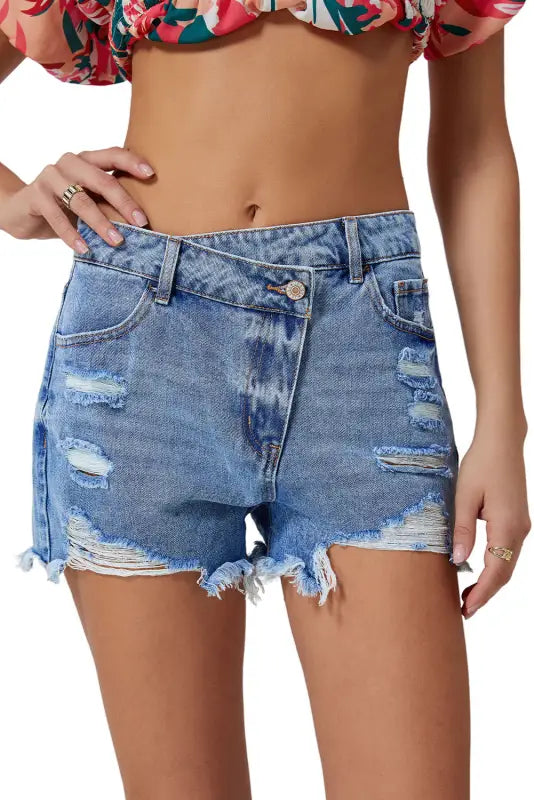 Crossover waist denim shorts - distressed with frayed edges and rips for a relaxed look