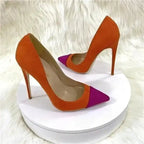 Classic Suede High Heels by FashionFitz displayed on white platform, featuring bold orange body and pink pointed toe design.