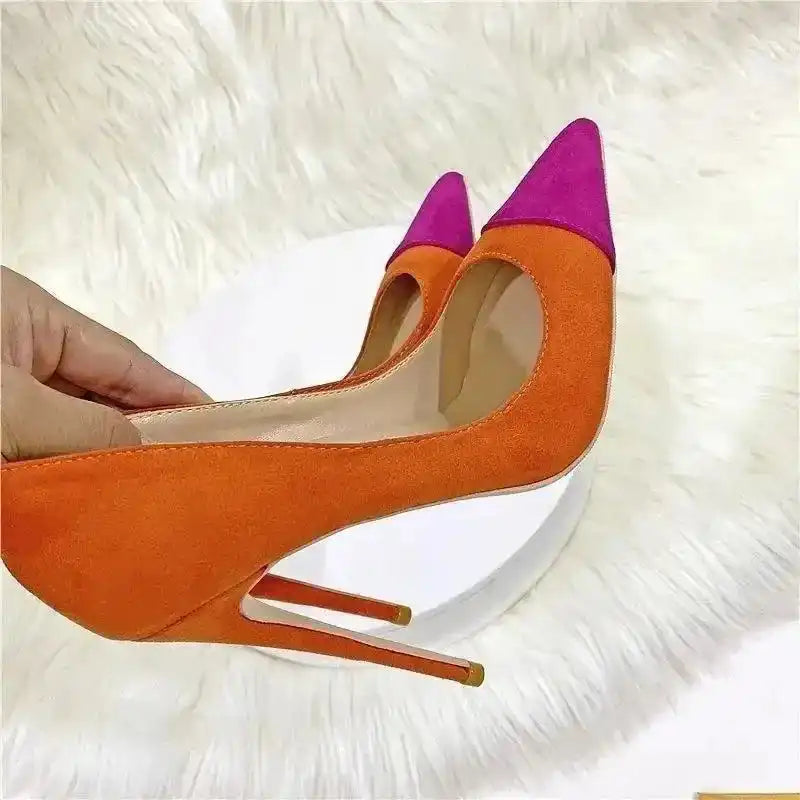 Close-up of FashionFitz Classic Suede High Heels showing orange suede texture and pink pointed toe, ideal for stylish events.