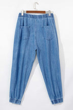 Rear flat lay of Plus Size Blue Denim Joggers showing elastic waistband and dual back pockets, crafted for casual plus size wear.
