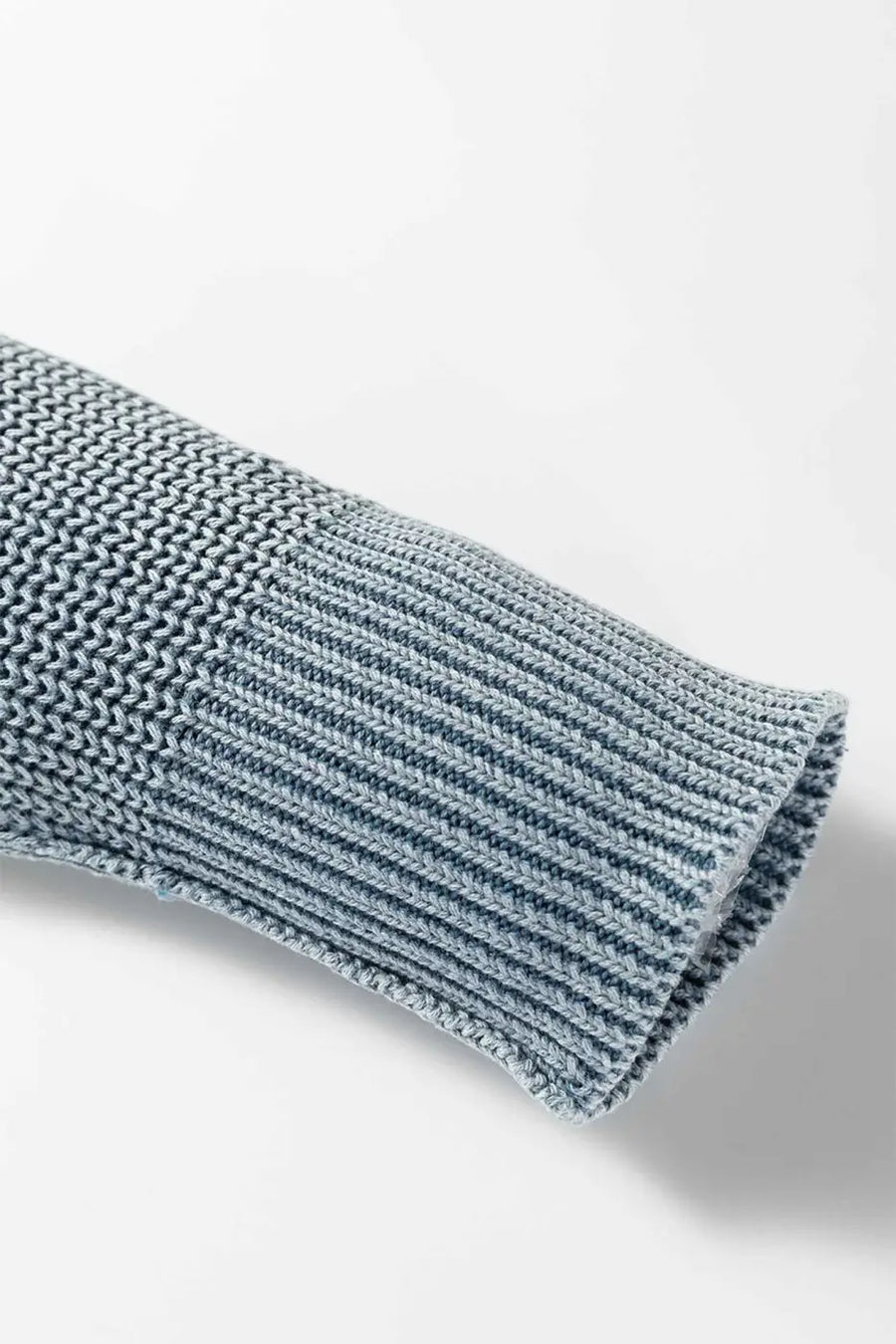 Cuff detail of blue Women's Stonewash Patchwork Knit Open Cardigan, highlighting ribbed knit and soft finish.