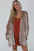 Draped velvet kimono paired with boots and neutral basics