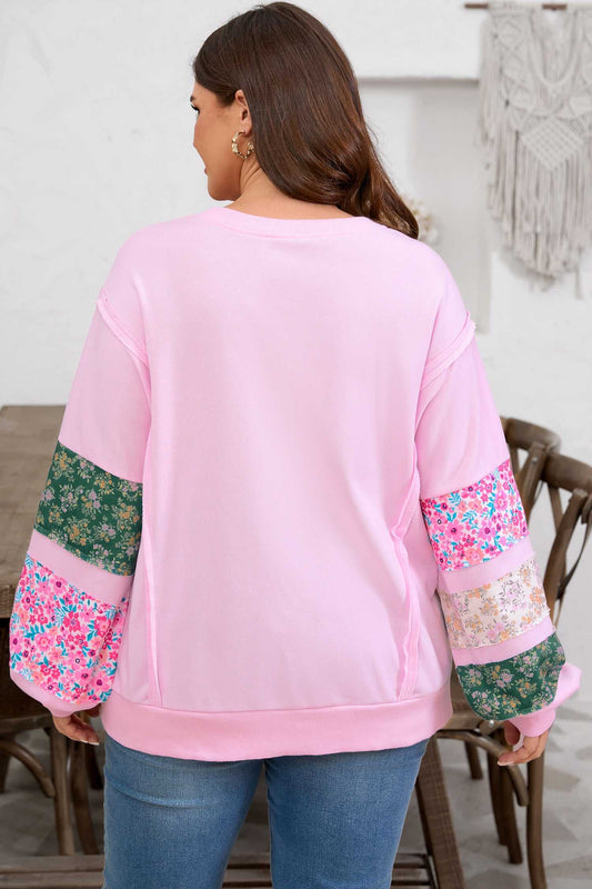 Back view of Curve Pink Floral Sleeve Baggy Sweatshirt for Women showing relaxed fit and floral sleeve details in green and pink tones.
