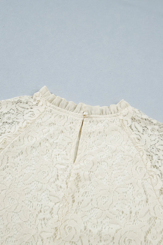 Women's floral lace round neck blouse close-up detail