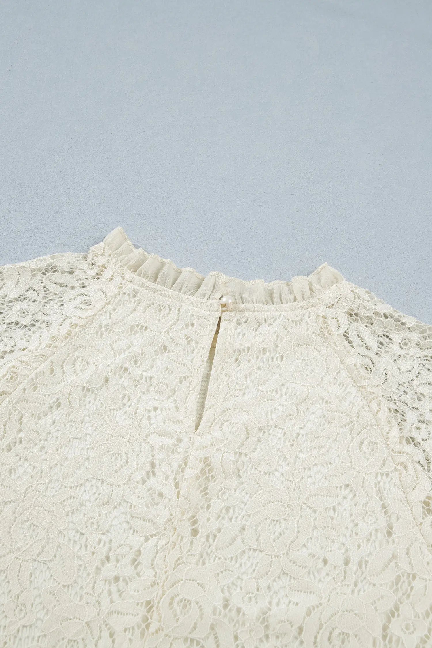 Women's floral lace round neck blouse close-up detail