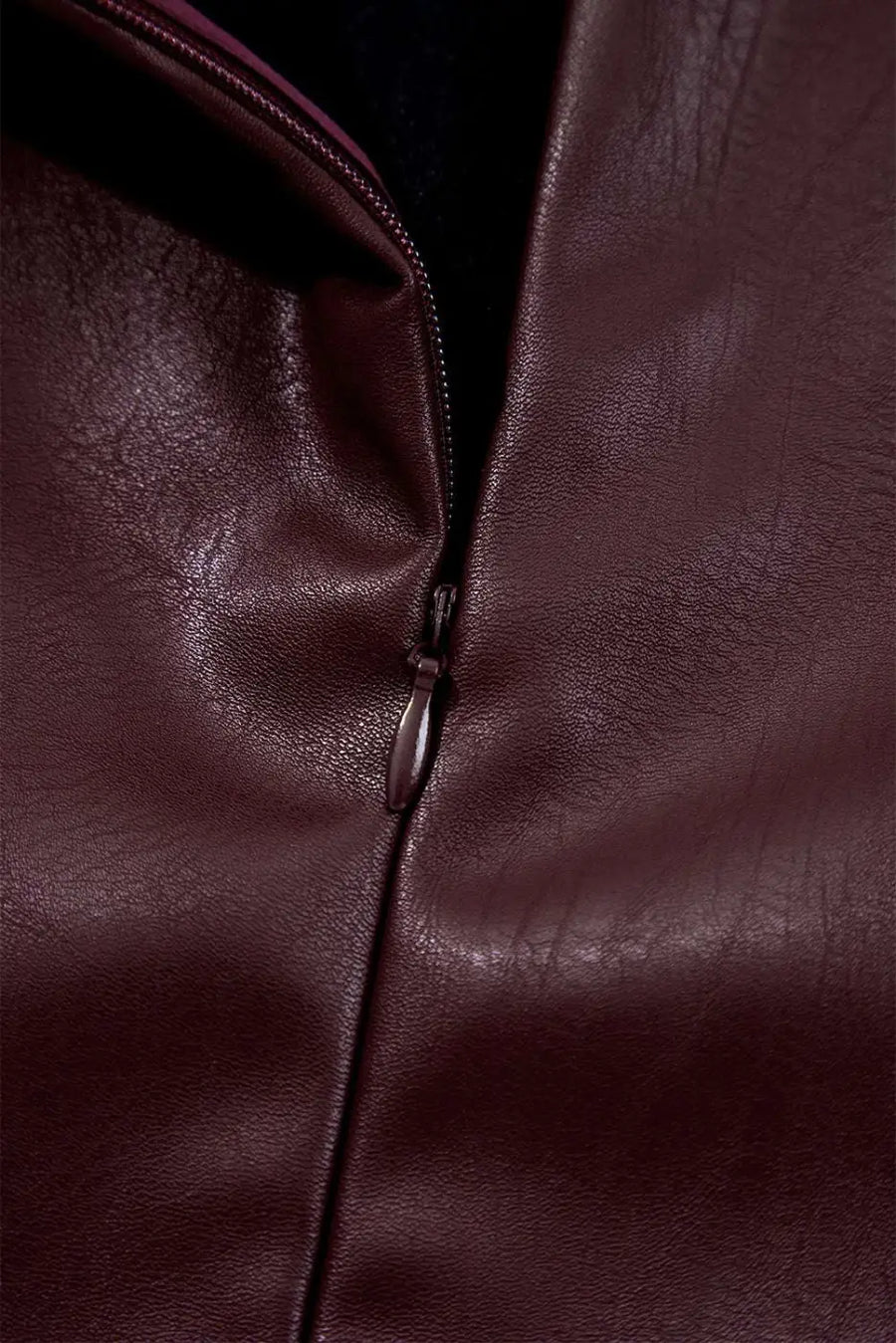 Close-up of zipper on Brown Faux Leather Sleeveless Mini Dress highlighting the high-quality PU leather material and stitching.