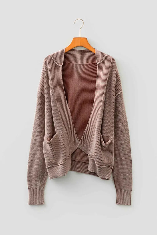 Brown stonewash patchwork knit open cardigan on wooden hanger, showing open front and dual pockets for versatile styling.