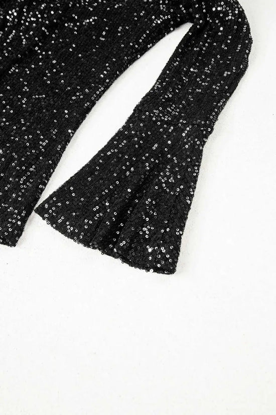 Bell sleeve detail of black sequin evening blouse, showcasing elegant flare and shimmering texture for night out looks.