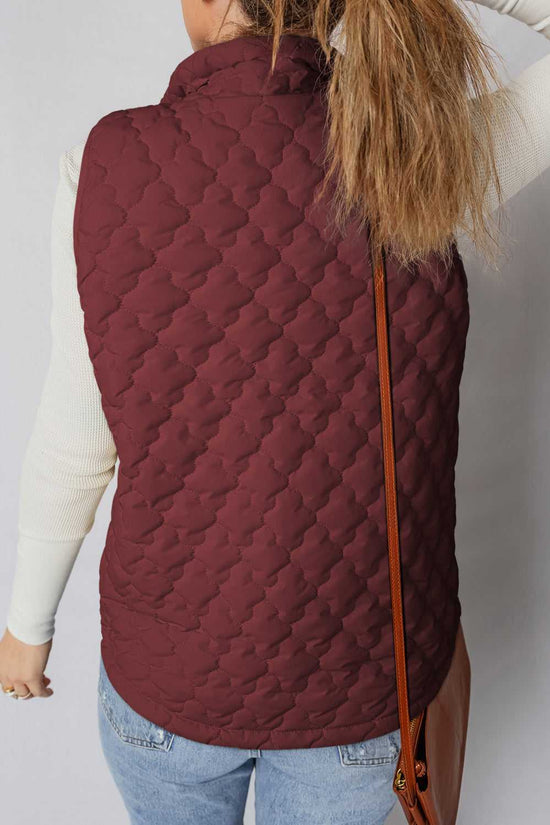 Back view of burgundy Flower‑Quilted Winter Gilet showing padded sleeveless design and floral quilt pattern for women’s winter outerwear.