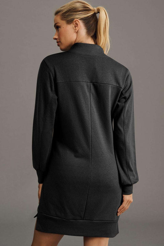 Back view of black zip-up sweatshirt mini dress featuring long sleeves and ribbed hem, perfect for daily autumn wear.