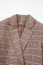 Close-up of collar and lapel on Ladies Brown Houndstooth Fitted Blazer, showing detailed houndstooth pattern and brown lining.