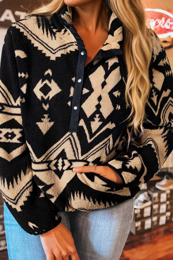 Women's Black Plus Size Aztec Print Plush Sweatshirt styled with jeans, featuring a cozy sherpa fleece texture and bold Western pattern.