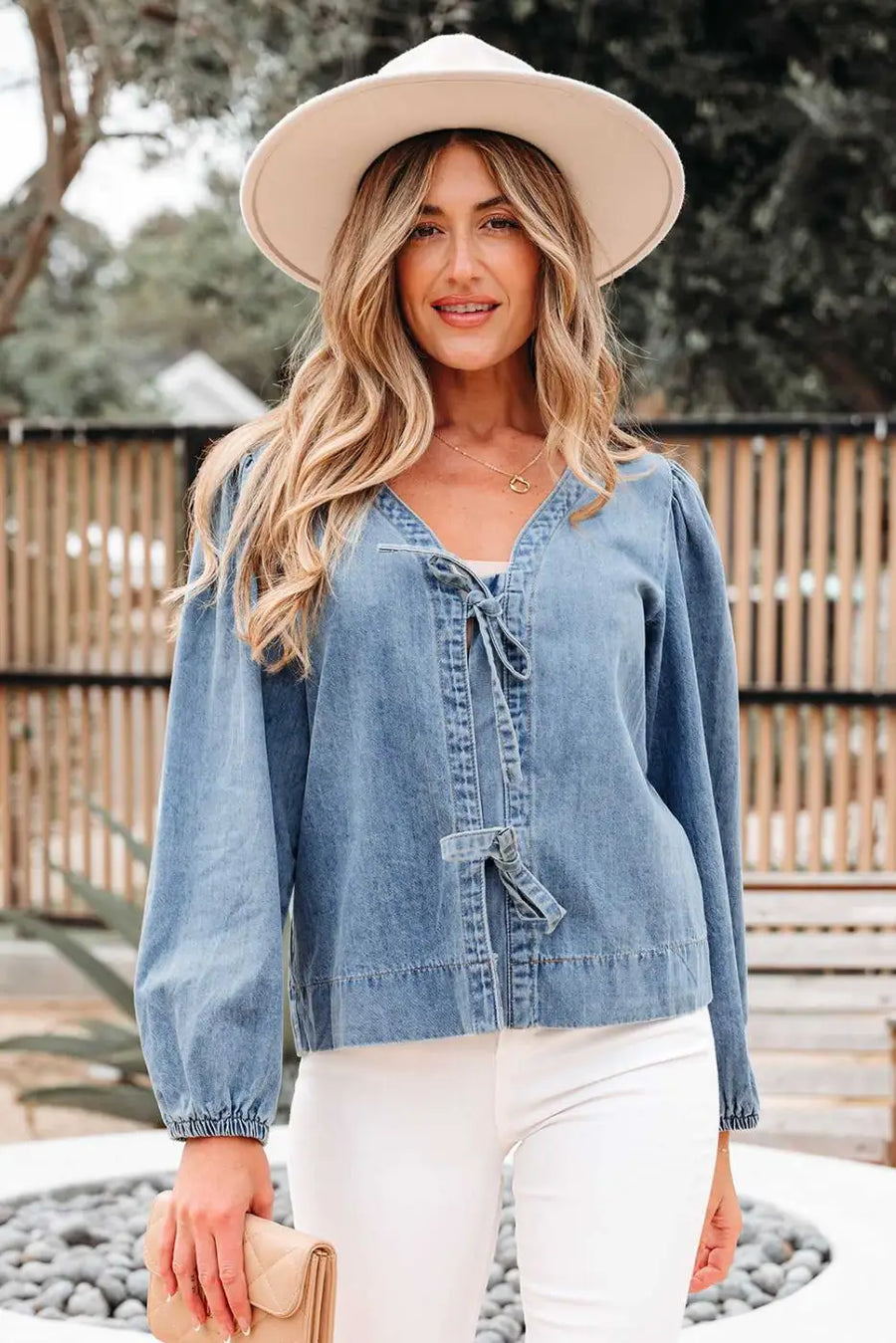 Close-up of Blue Denim Tie Knot Puff Sleeve Top showing bold tie knot accent and denim fabric texture — Fashionfitz