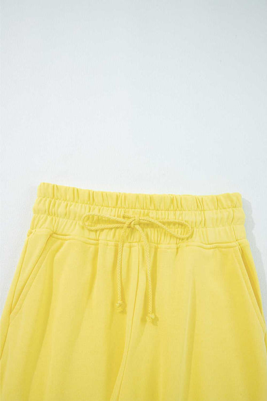 Elastic waistband and drawstring detail of yellow Drop Crop Wide-Leg Pants Set, designed for adjustable fit and ease.