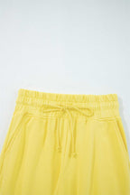Elastic waistband and drawstring detail of yellow Drop Crop Wide-Leg Pants Set, designed for adjustable fit and ease.