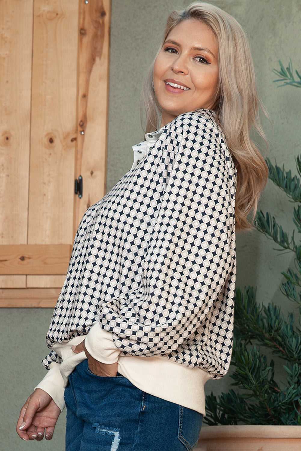 Side angle of Curve Monochrome Contrast Polo Sweatshirt for Women highlighting the soft fabric and casual silhouette.