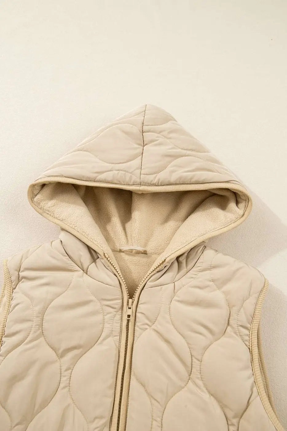 Close-up of khaki Quilted Fleece‑Lined Winter Gilet hood showing soft fleece lining and quilted stitching detail.