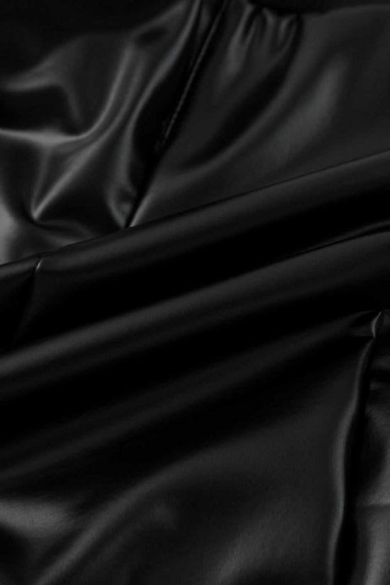 Texture detail of Black Vegan Leather Leggings – High‑Rise Skinny Fit highlighting soft, glossy PU leather with stretch comfort.