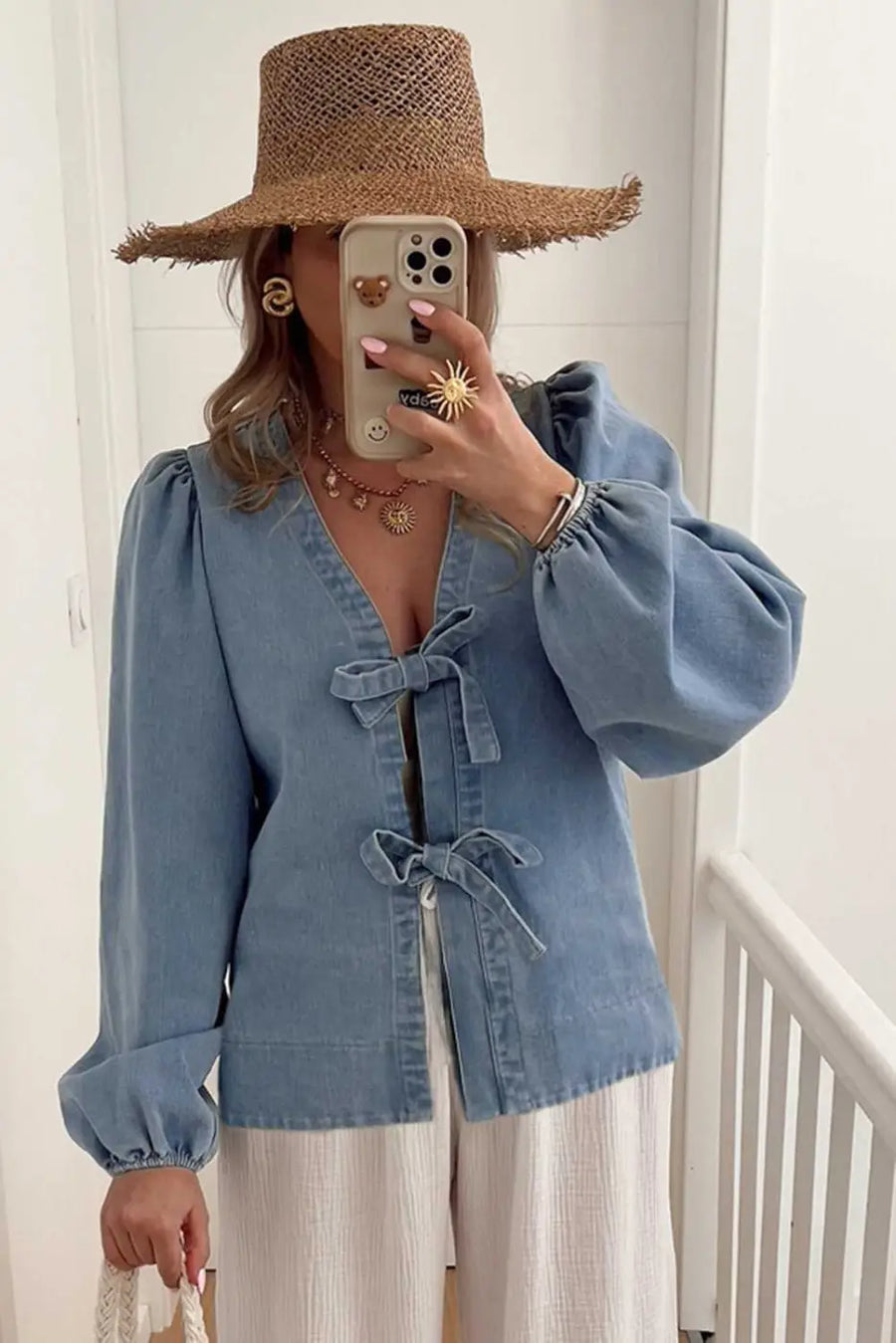 Side view of Blue Denim Tie Knot Puff Sleeve Top showing puff sleeve structure and flutter detail — Fashionfitz