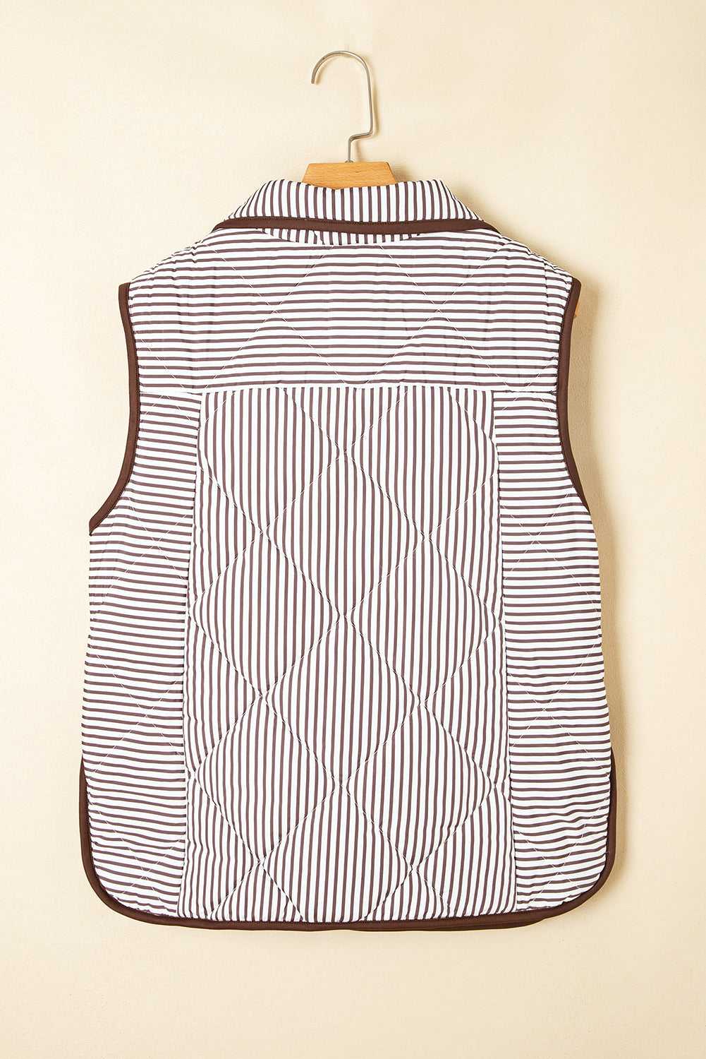 Back view of the Stripe Snap Winter Vest on hanger, highlighting quilted design and striped fabric for added warmth and texture.