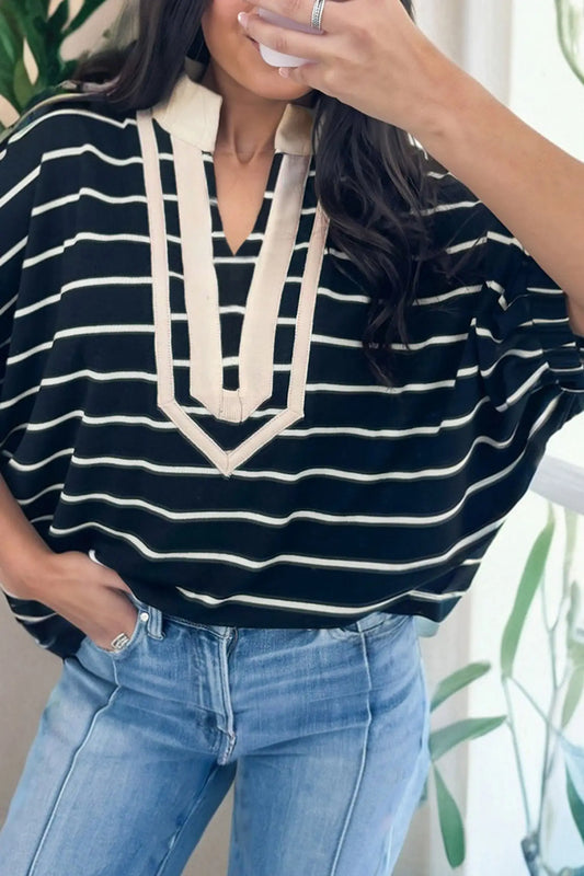 Woman wearing black stripe stand collar V-neck dolman top with elastic cuffs front view Fashionfitz UK