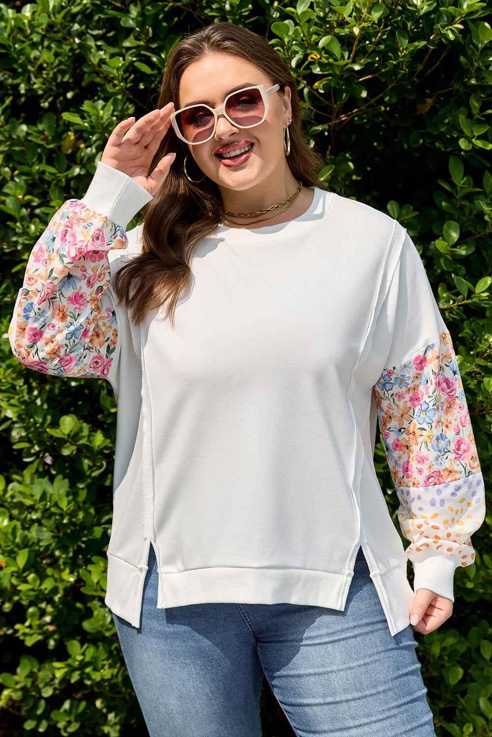 White plus size sweatshirt with floral and polka dot patchwork sleeves. Designed for stylish comfort and casual southern belle fashion.