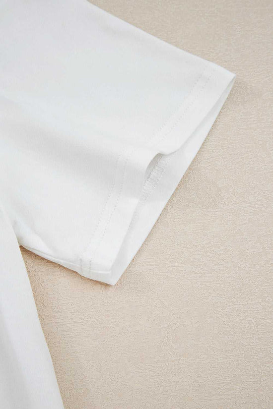 Detail of the short sleeve hem on the 'Mama Claus' tee from the Ladies Nutcracker Christmas Lounge Set by FashionFitz UK, highlighting stitching quality.