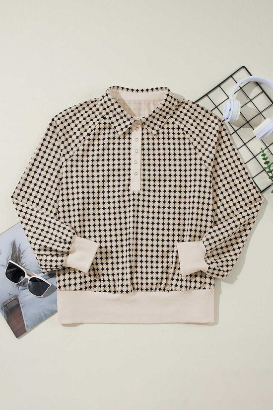 Flat lay of Curve Monochrome Contrast Polo Sweatshirt for Women with cream trim and black and white pattern, ideal for casual wear.