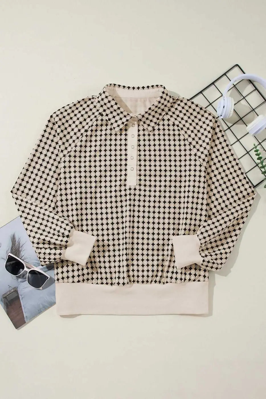 Flat lay of Curve Monochrome Contrast Polo Sweatshirt for Women with cream trim and black and white pattern, ideal for casual wear.