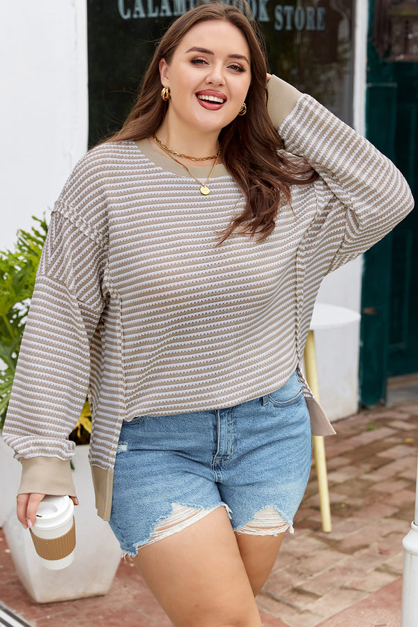 Woman wearing stripe breathable knit ribbed trim plus size long sleeve top