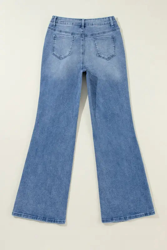 Pair of light blue flared denim jeans with wide legs from distressed elegance wide-leg jeans