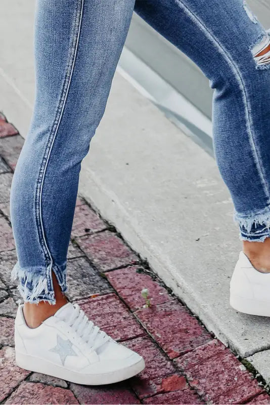 Light blue distressed frayed ankle skinny jeans